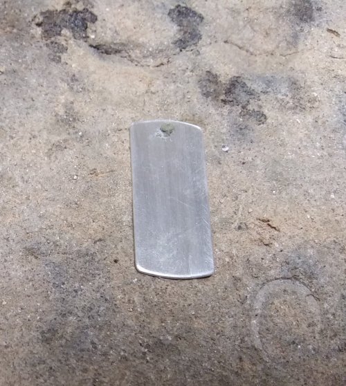 Judy Larson's Dog Tag Style Necklace - , Metalwork, How To Punch Holes, Hole Punching, Punch A Hole, Place the rectangle on a magnesia soldering block.